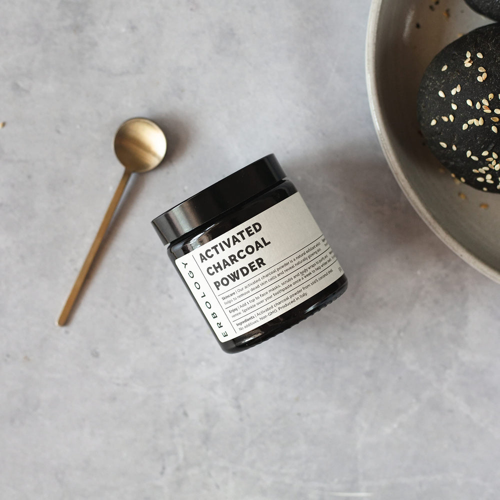 Using activated charcoal powder for teeth whitening on a toothbrush