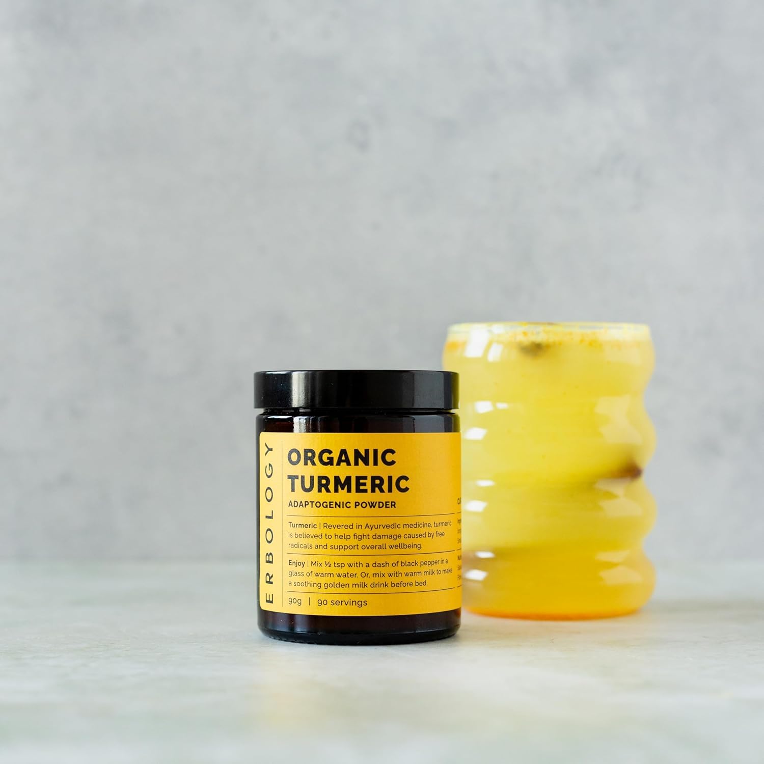 Turmeric powder held in hand showing texture