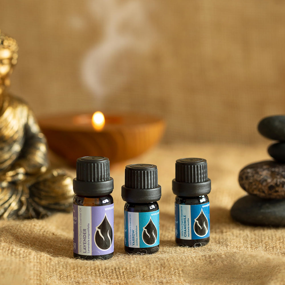 Lavender essential oil bottle with dropper on wooden surface