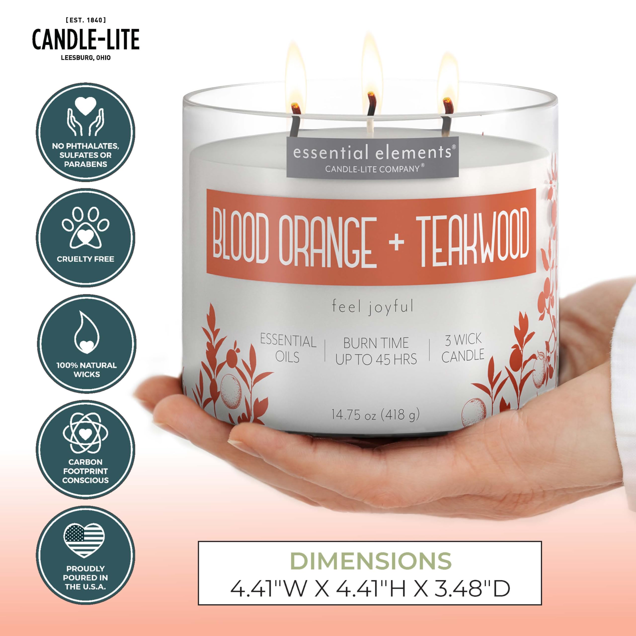 Essential Elements Blood Orange Teakwood candle glow creates a warm, cozy ambiance