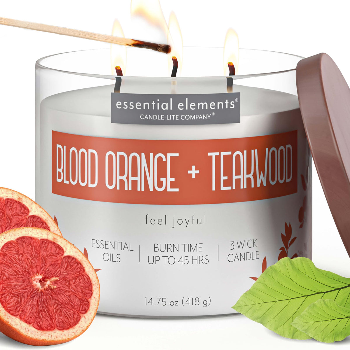 Essential Elements Blood Orange Teakwood candle side view emitting vibrant citrus aroma for any space
