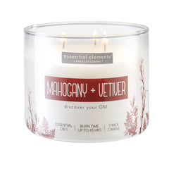 Essential Elements Mahogany Vetiver candle jar amber glow for a calming living space.