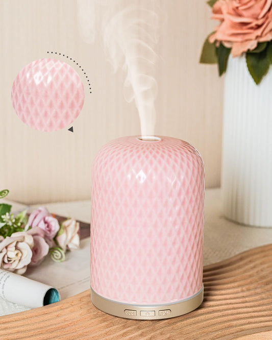 Pink ceramic essential oil diffuser with gold base