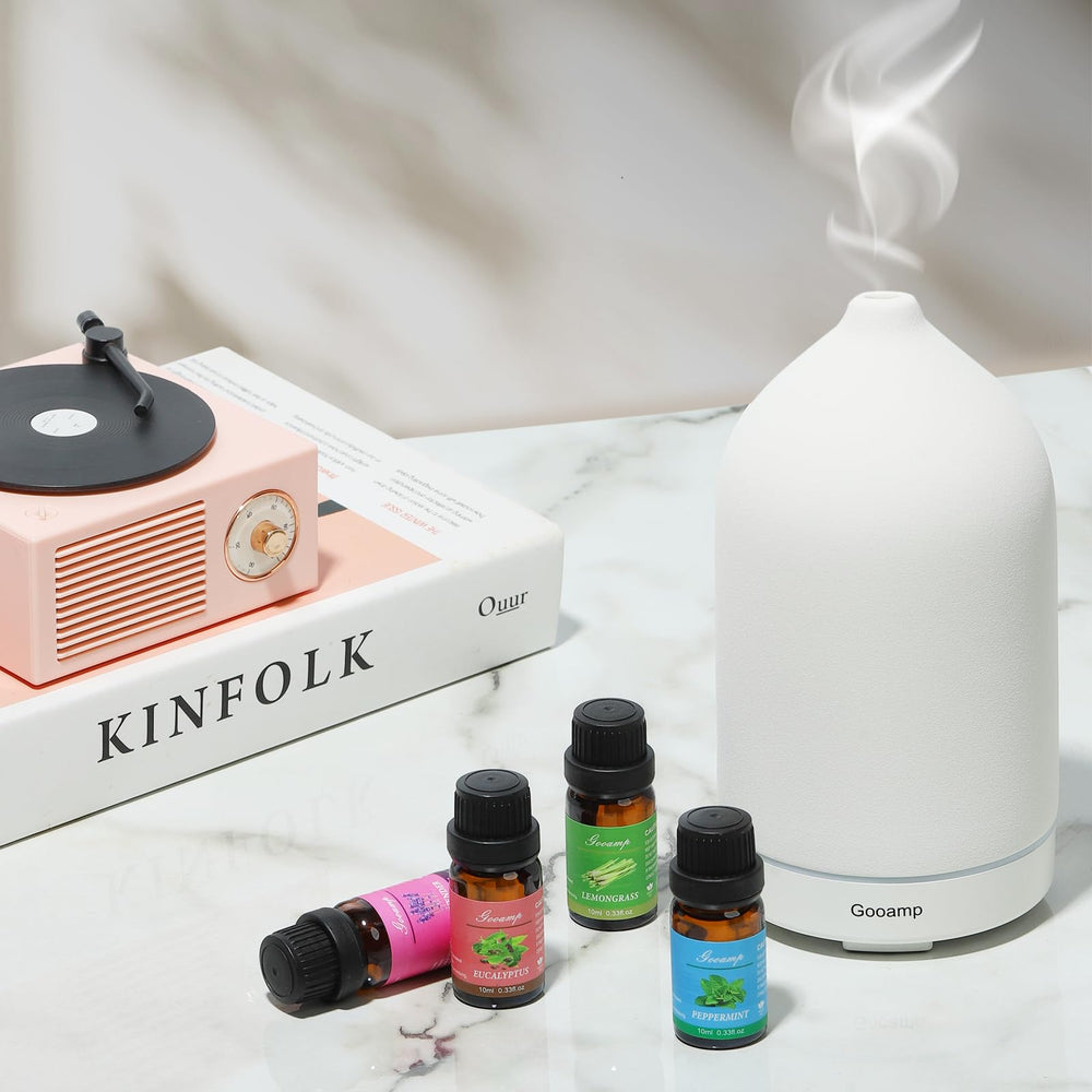 Six dark glass bottles from the Essential Oils Set Top 6 Organic Blends