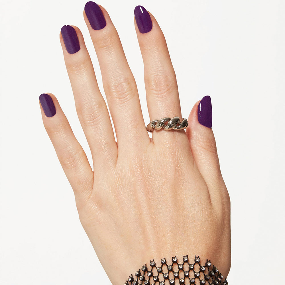 essie Underground Ball shown under different lighting to reveal red undertones.