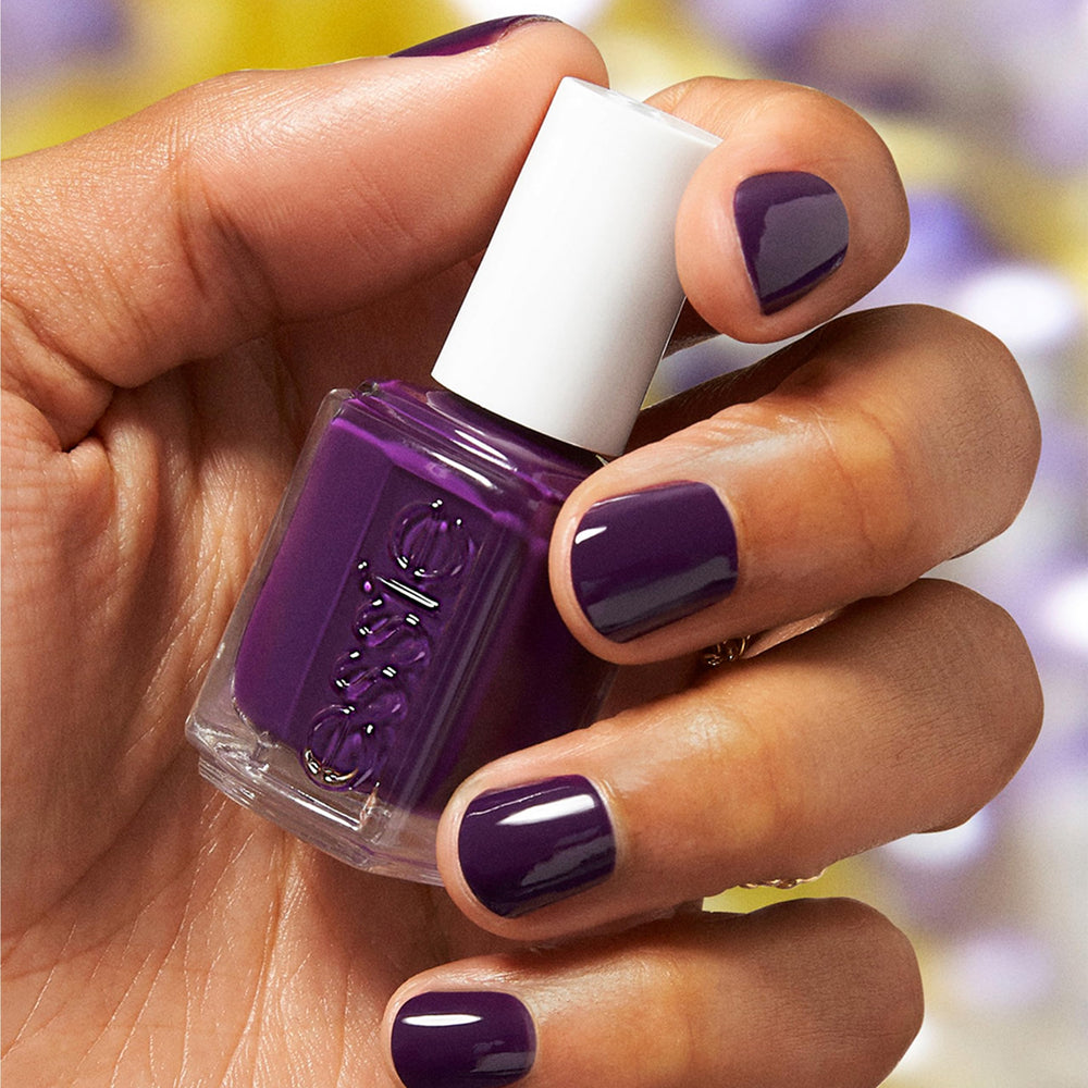 essie Underground Ball swatches on skin show the plum shade in daylight.