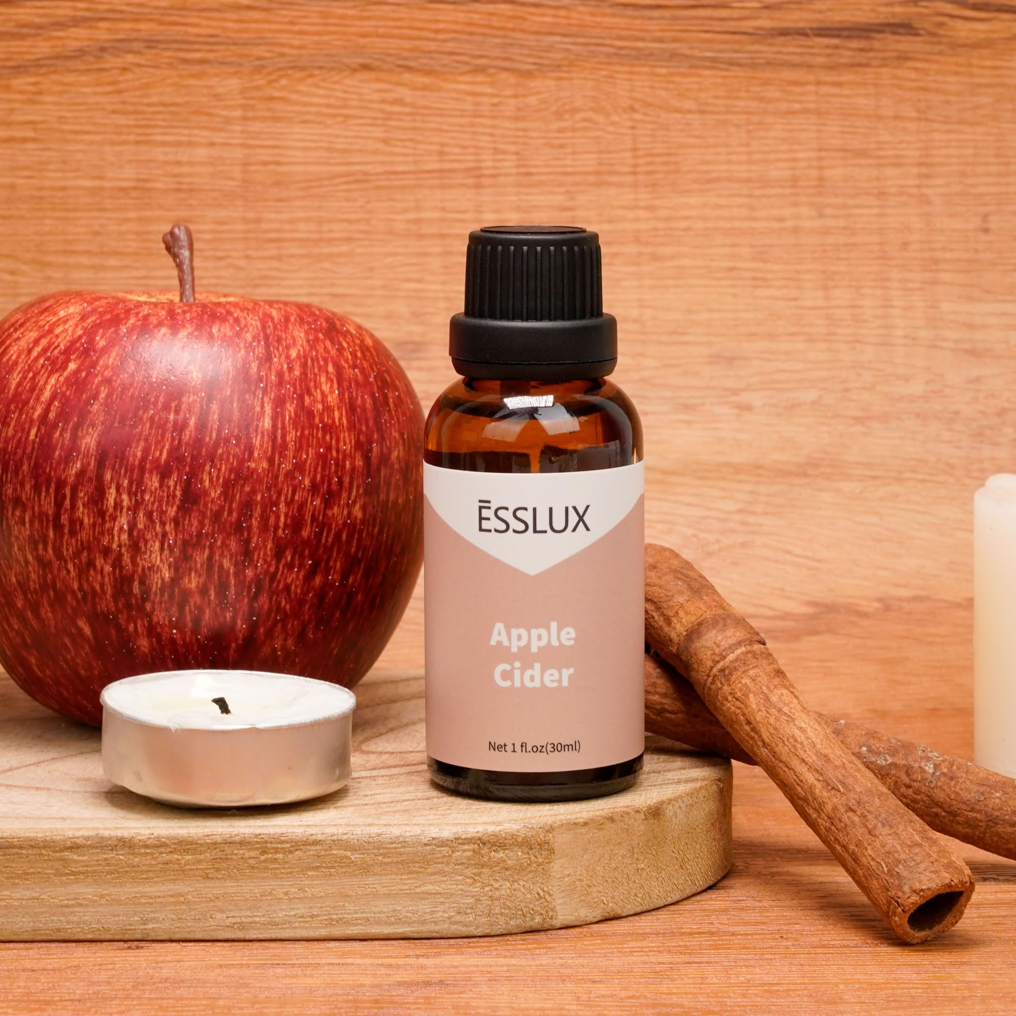 ESSLUX bottle on a cozy kitchen counter with mug, evoking a warm home fragrance benefit