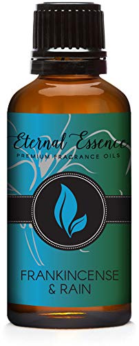 Amber glass 30ml bottle of Eternal Essence Oils Frankincense & Rain fragrance oil with black cap