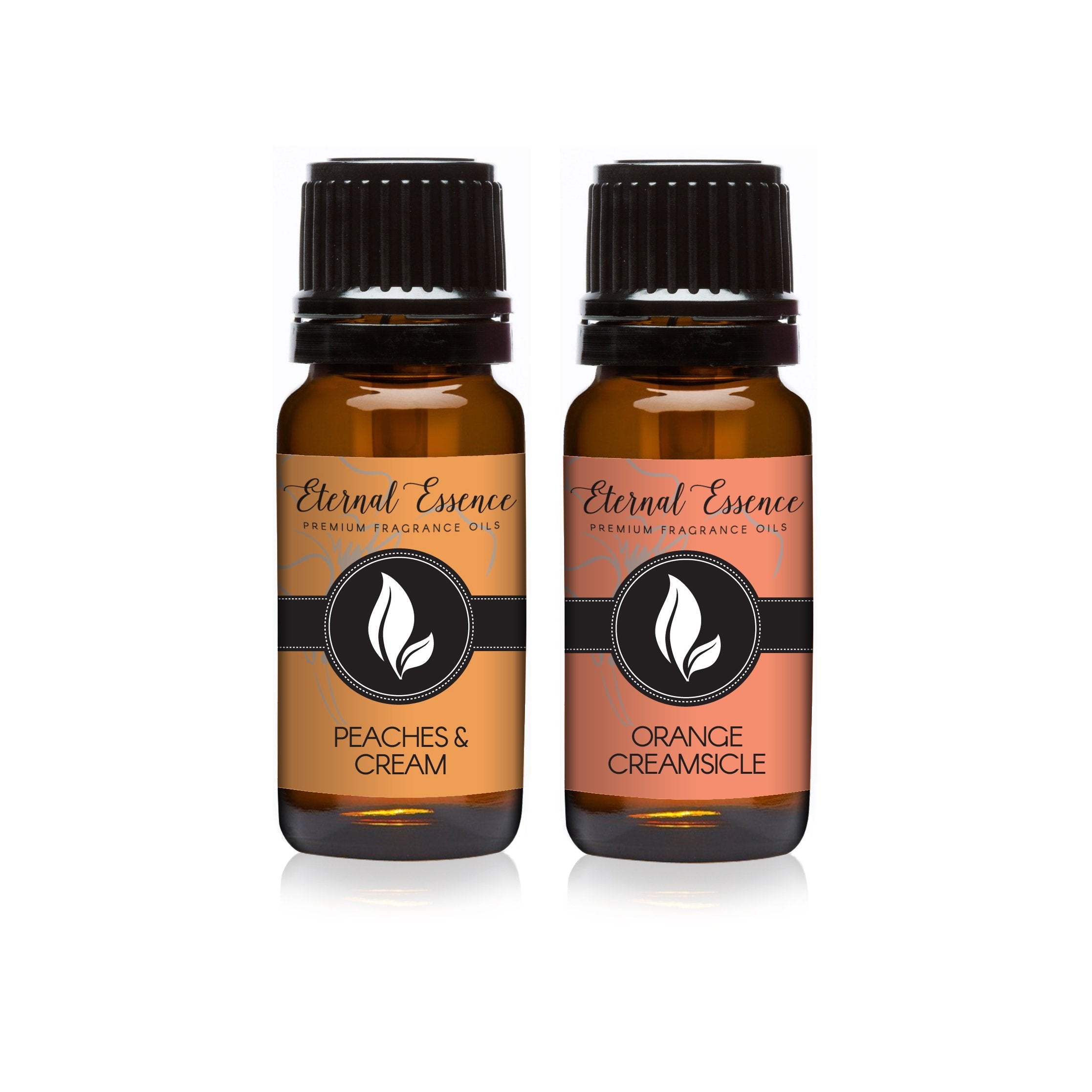 Two 10ml amber glass fragrance oil bottles: Peaches & Cream and Orange Creamsicle