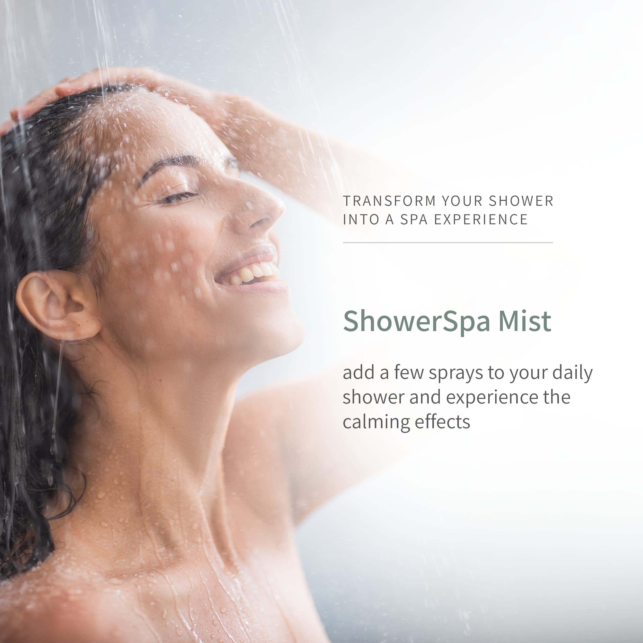 Showerhead releasing aromatherapy mist in a modern bathroom