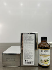 Close-up of glass dropper dispensing ginger essential oil