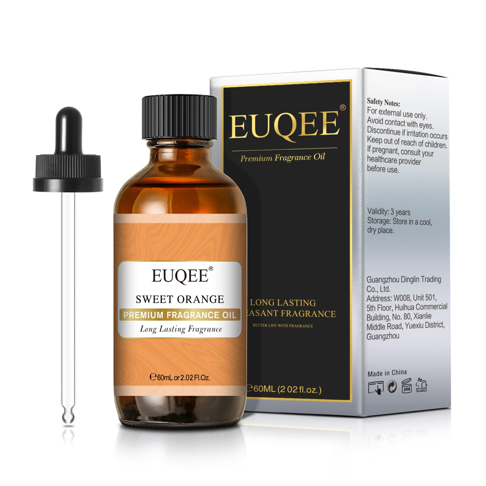 Lifestyle shot of orange fragrance oil and amber glass bottle