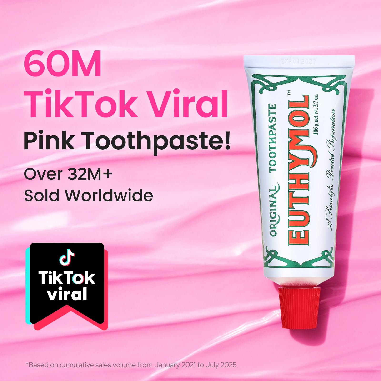 Pink toothpaste tube close-up showing branding