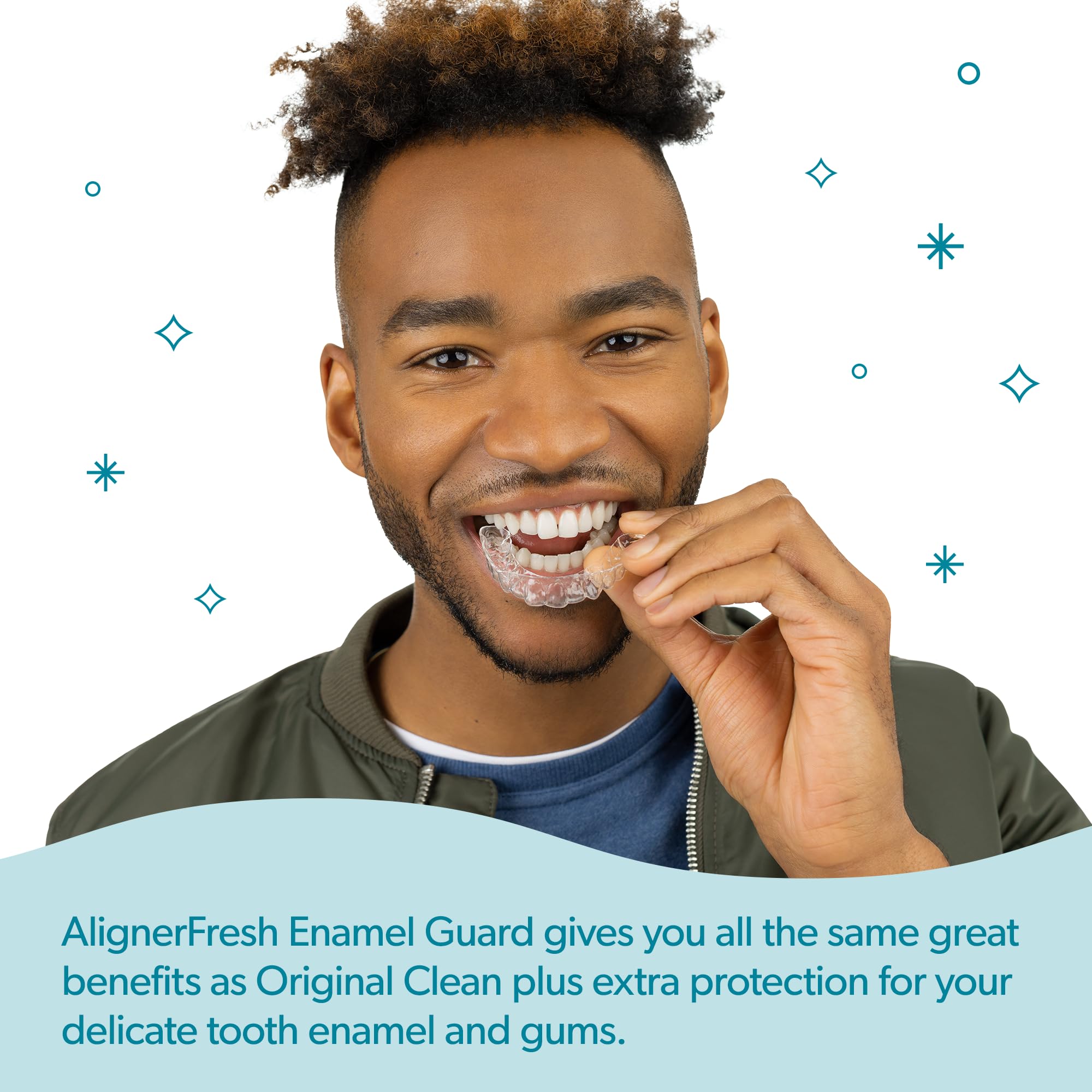 Close-up of aligners being cleaned with Enamel Guard foam