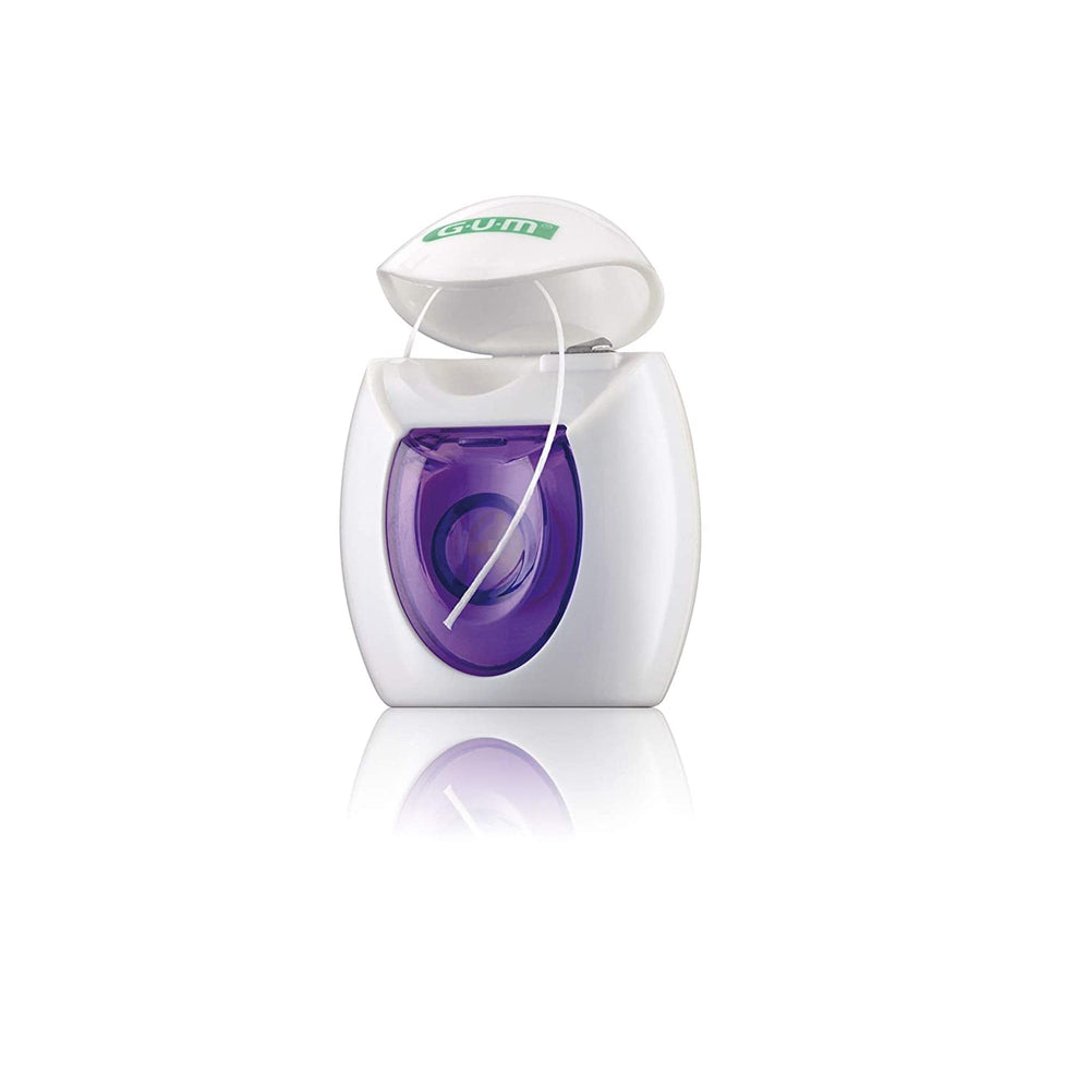 Soft waxed dental floss sliding between teeth