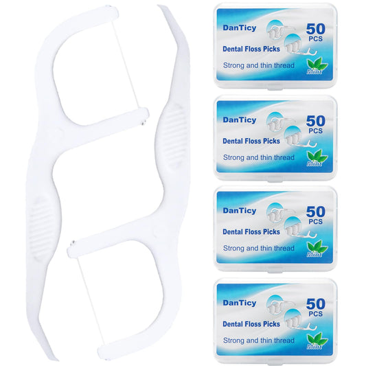 Packaging showing four packs of extra strong dental floss picks