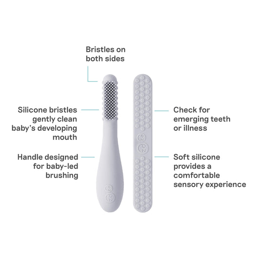 Angle view of ezpz Pewter Baby-Led Toothbrush