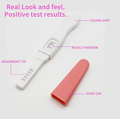 Two pink prank pregnancy test sticks in retail box
