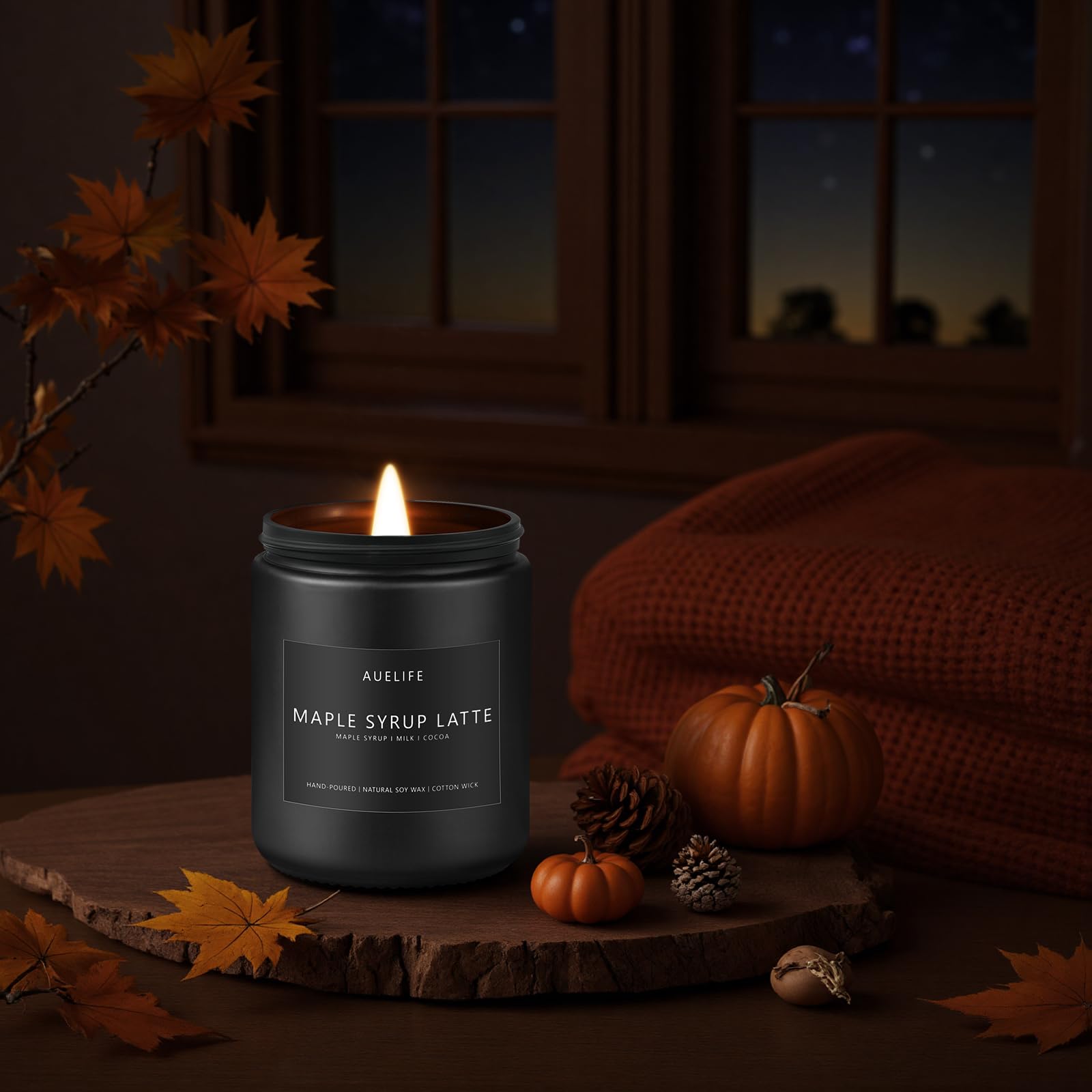 Chic minimalist glass jar candle with autumn accents