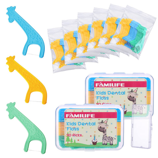 Giraffe-shaped kid floss picks in hand