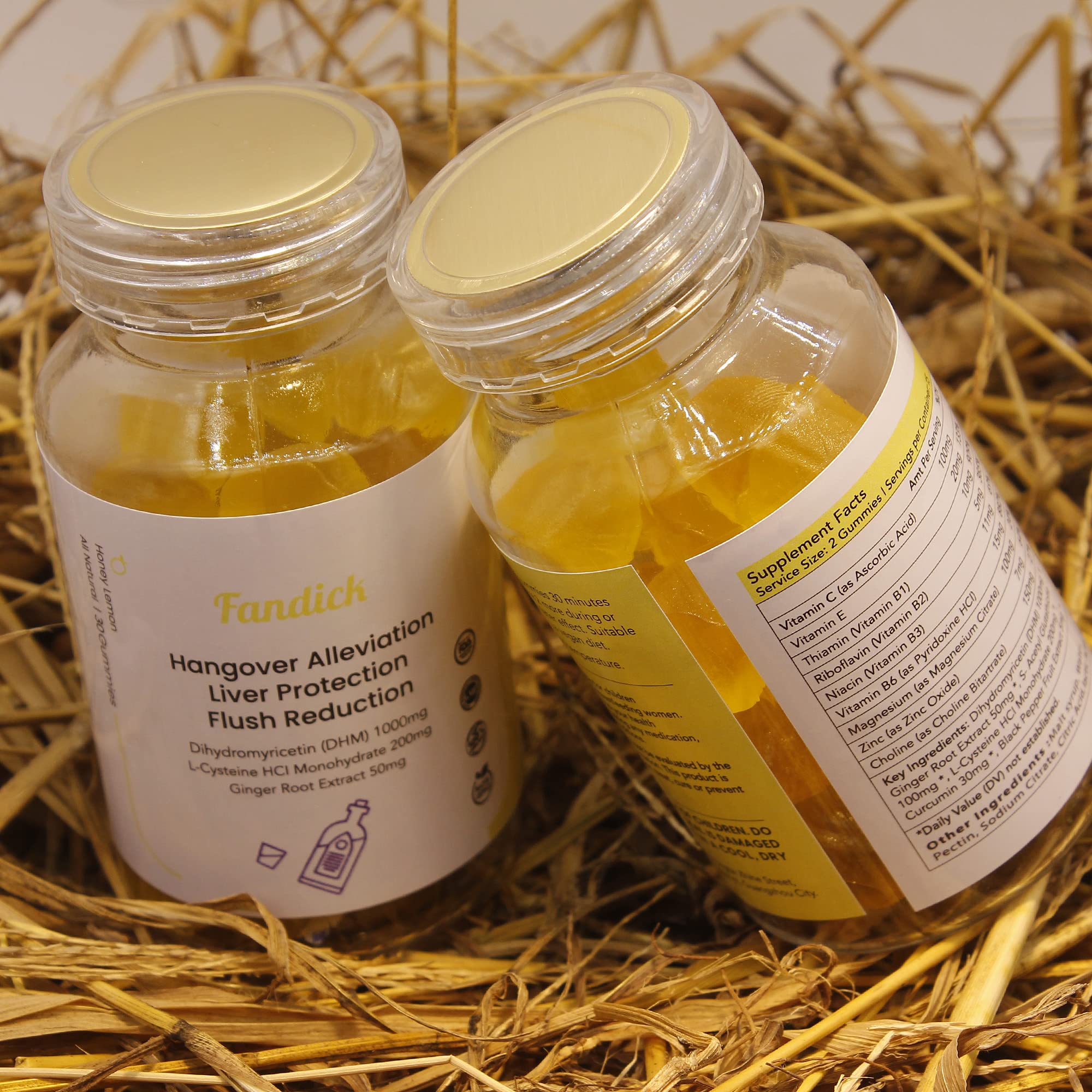 Gummies with lemon-honey flavor on white background