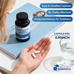 Two capsules from Femmetra probiotic bottle