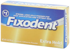 Applying Fixodent Extra Hold Powder to dentures - 1.6 oz packaging