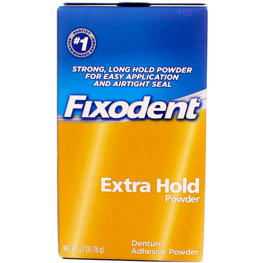 Close-up of Fixodent Extra Hold powder being held