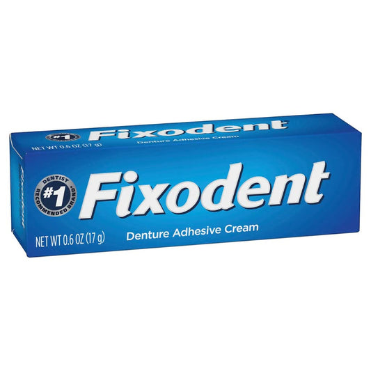 Close-up of Fixodent adhesive cream tube showing strong hold