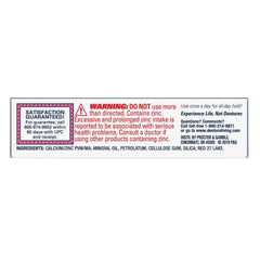 Denture securely held with Fixodent adhesive cream