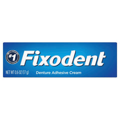 Smiling person wearing dentures with Fixodent Secure for confidence