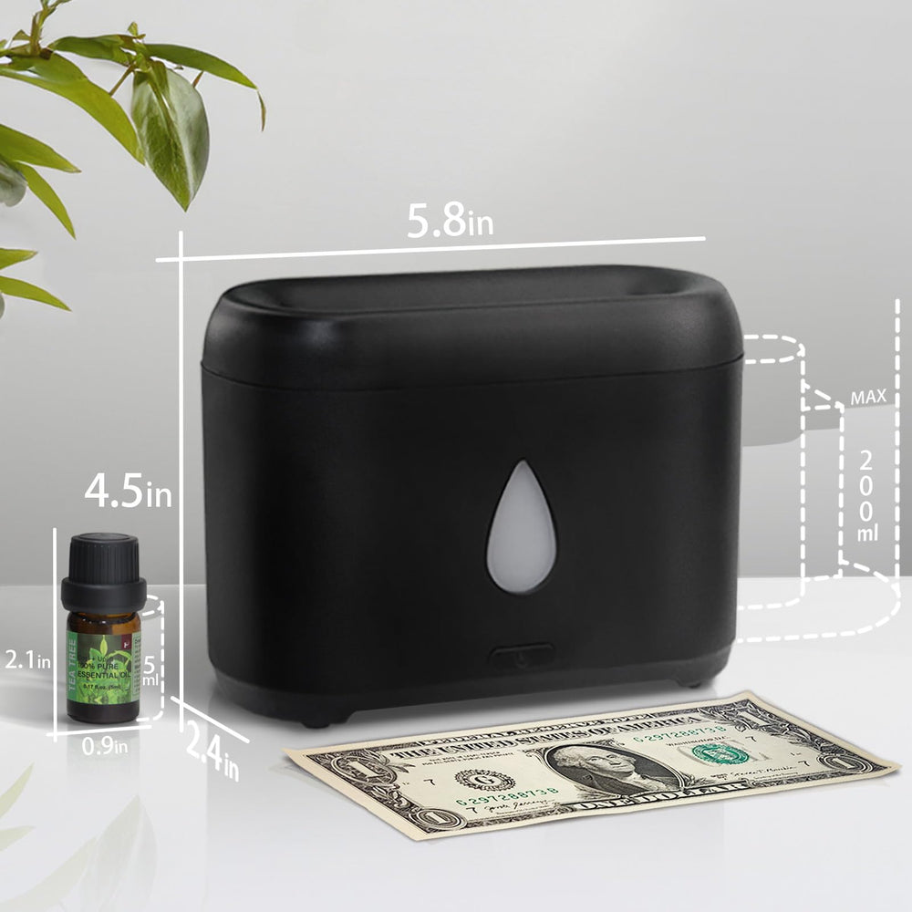 Aromatherapy diffuser operating quietly on a desk with a soft flame glow
