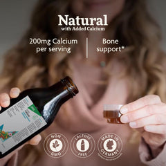Pouring Floradix Calcium Liquid into a glass