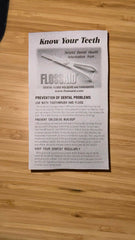 Person using Flossaid dental floss holder
