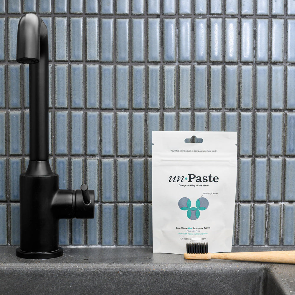 Close-up of fluoride-free mint remineralizing toothpaste tablets.