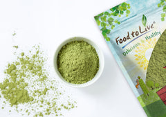 Alfalfa powder poured into a smoothie bowl