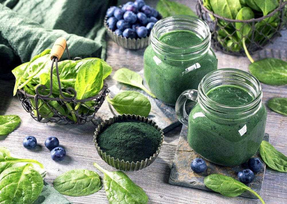 Chlorella powder being added to a smoothie
