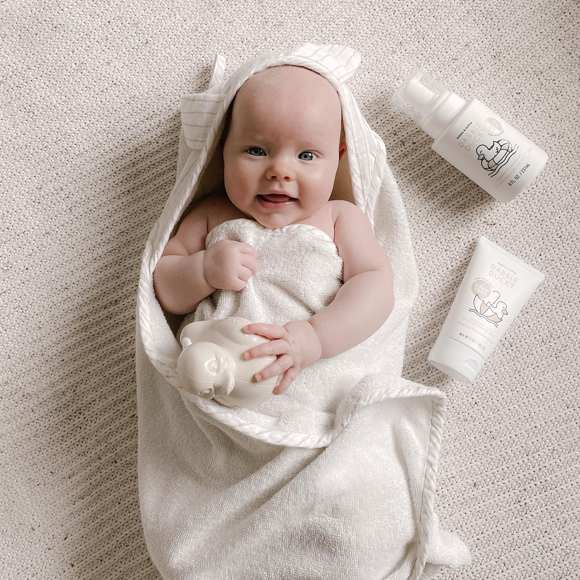 Close-up of tear-free fragrance-free baby wash showing gentle foaming action.