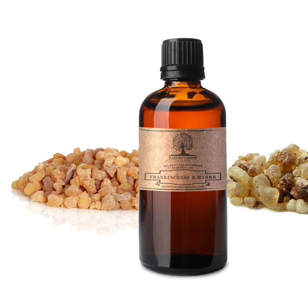 Amber glass bottle of Frankincense & Myrrh essential oil.