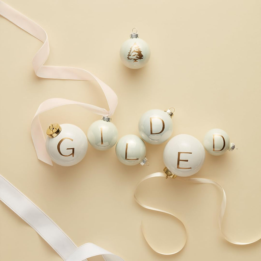 Gift-ready presentation of the Frasier Fir candle with gilded accents