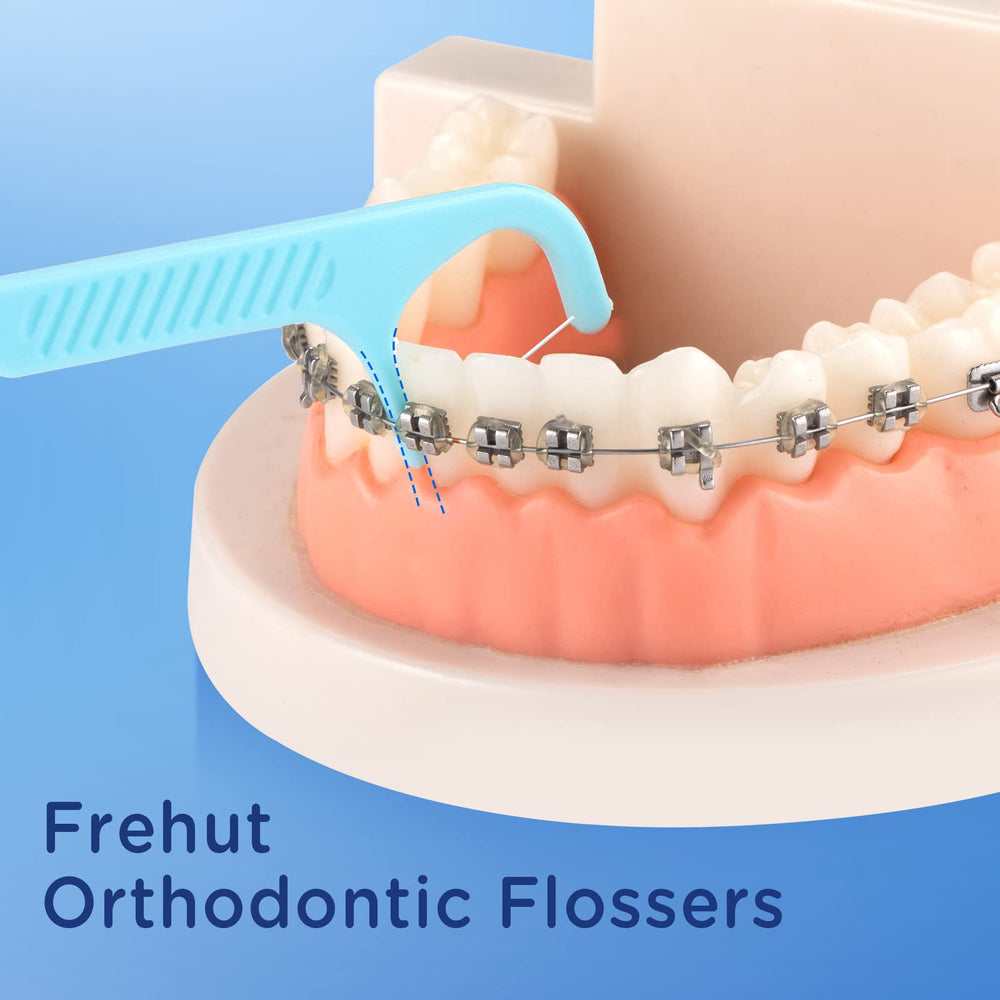 Close-up of Frehut orthodontic floss pick thin prong and tail hook