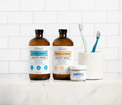 Mouthwash bottle beside a glass showing fluoride-free formula