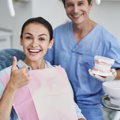 Retainers, dentures, and night guards being cleaned in the pod