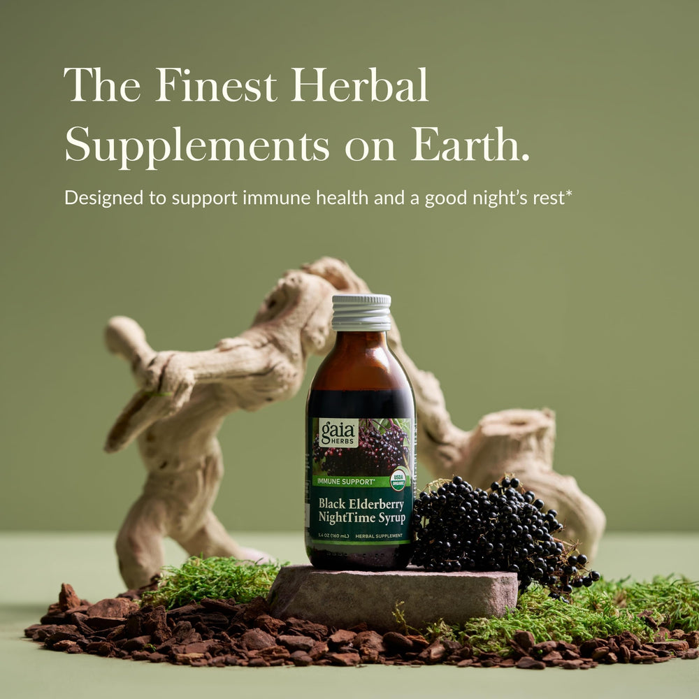 Pouring Gaia Herbs NightTime Syrup showing deep purple color