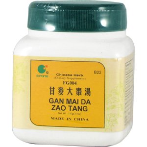 Close-up of Gan Mai Da Zao Tang herbal blend: licorice and jujube