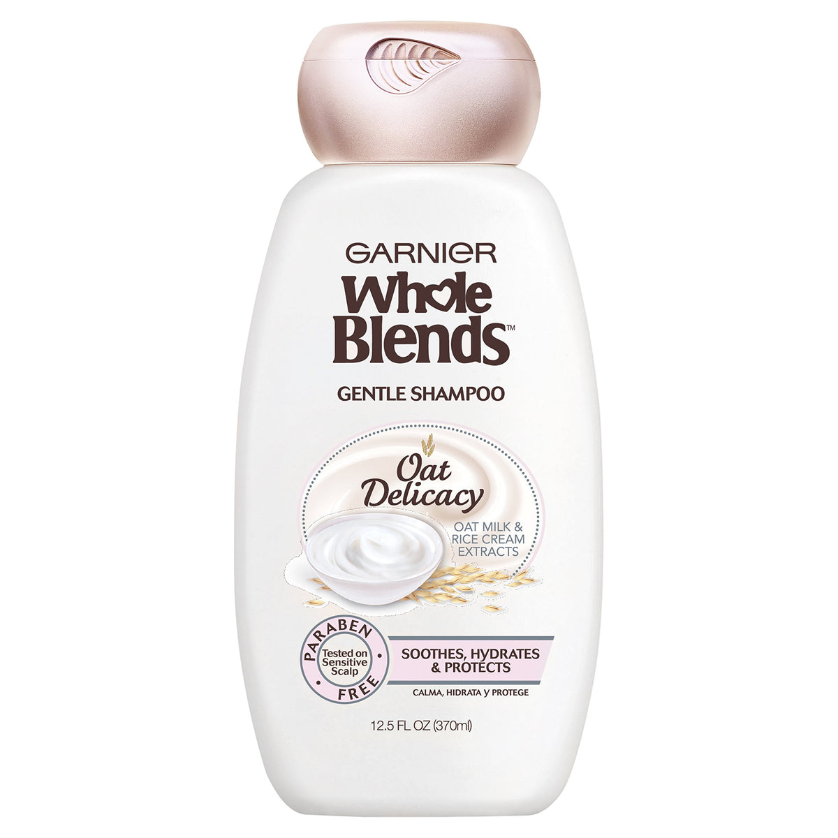 Garnier Whole Blends Gentle Shampoo Oat Delicacy bottle pouring for weightless hydration
