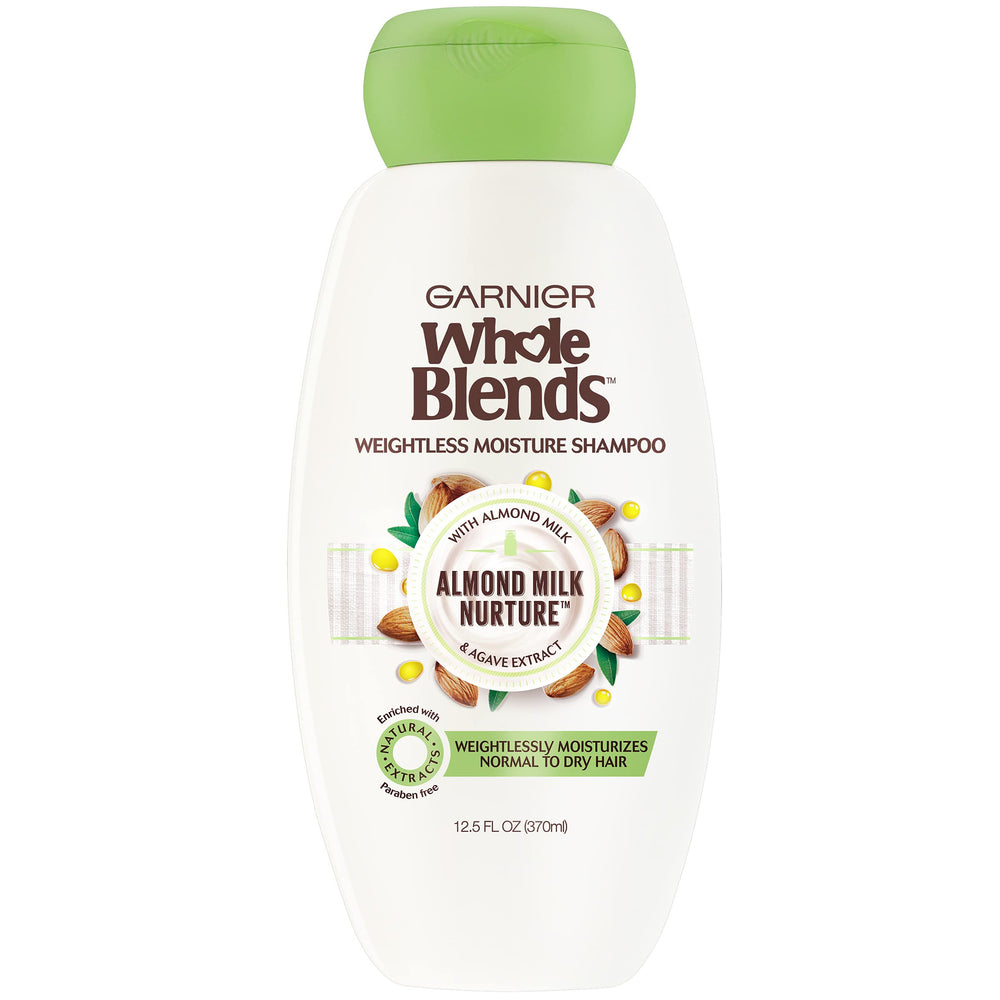 Garnier Whole Blends almond milk shampoo bottle close-up highlighting hydrating formula