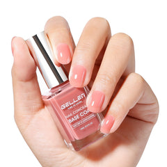 GELLEN Illuminating Nail Concealer Base Coat in dusty rose smooths ridges.
