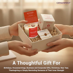 Gemanifest orange-scent candle in a study or workspace setting
