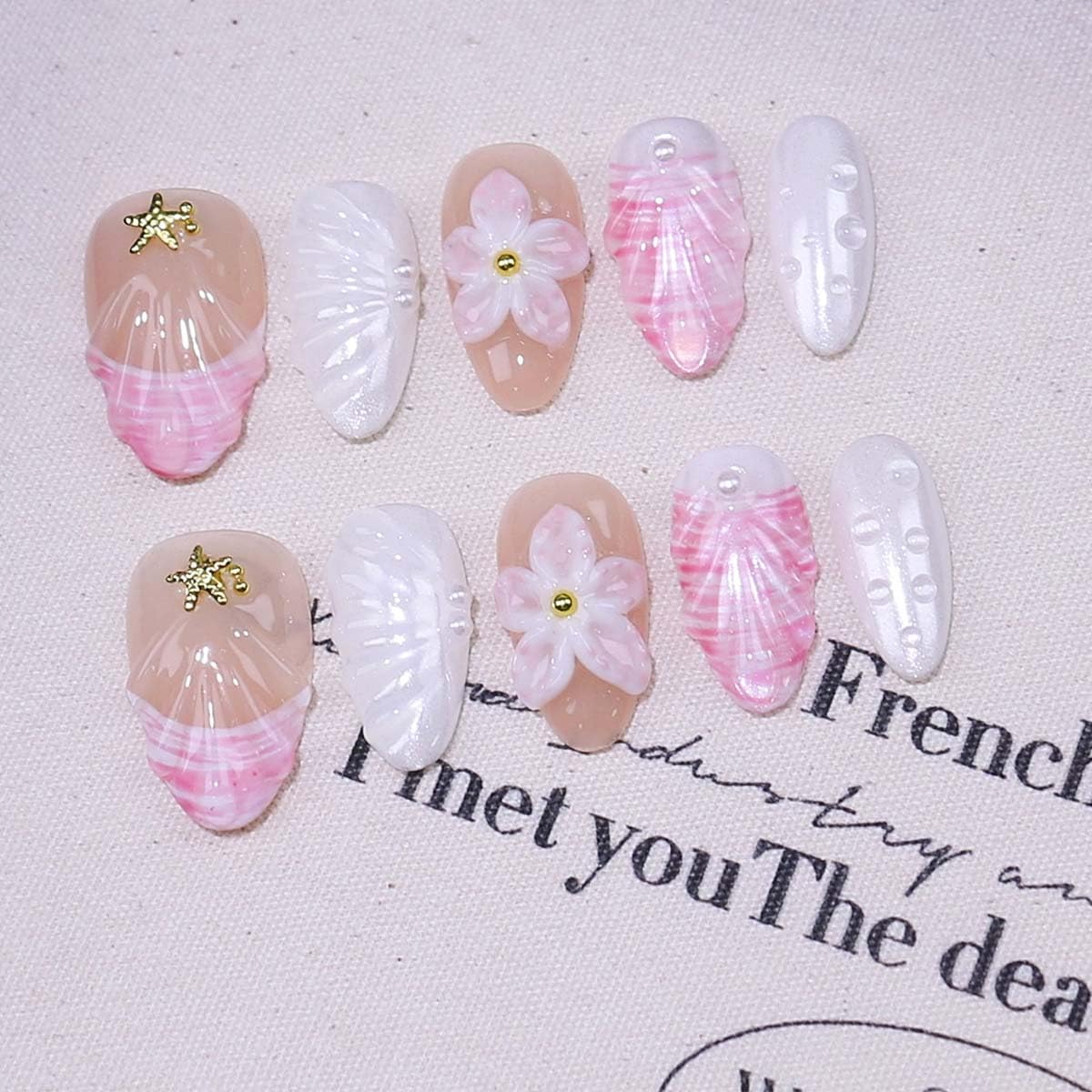 Generic Seashell 3D floral nails offer delicate seaside charm for timeless styling